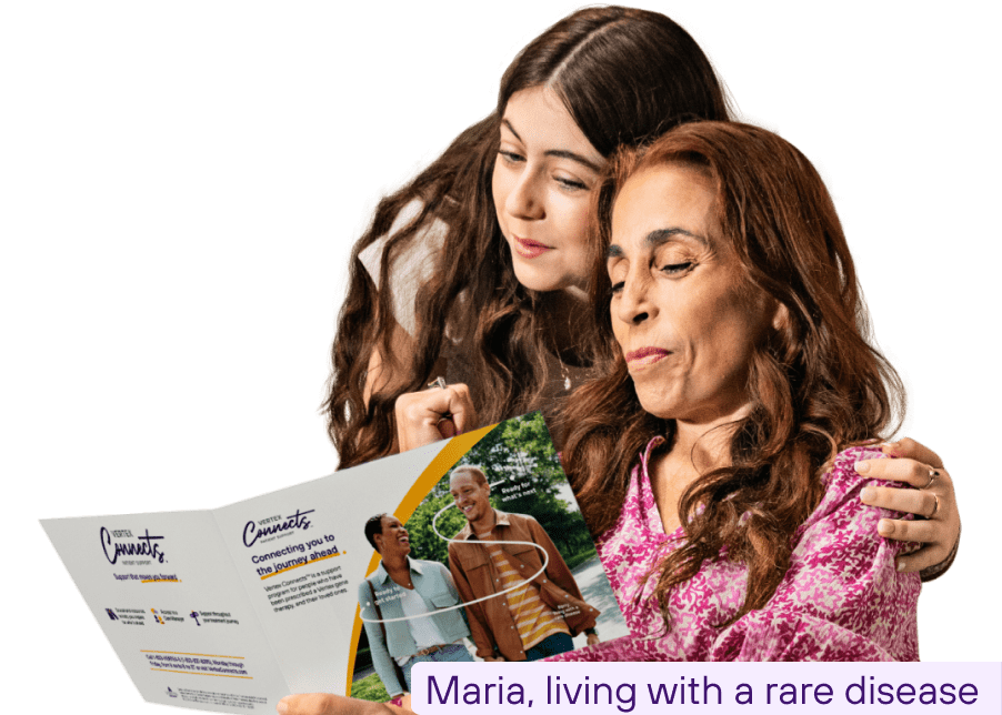 Maria, living with a rare disease, reads a Vertex Connects brochure.